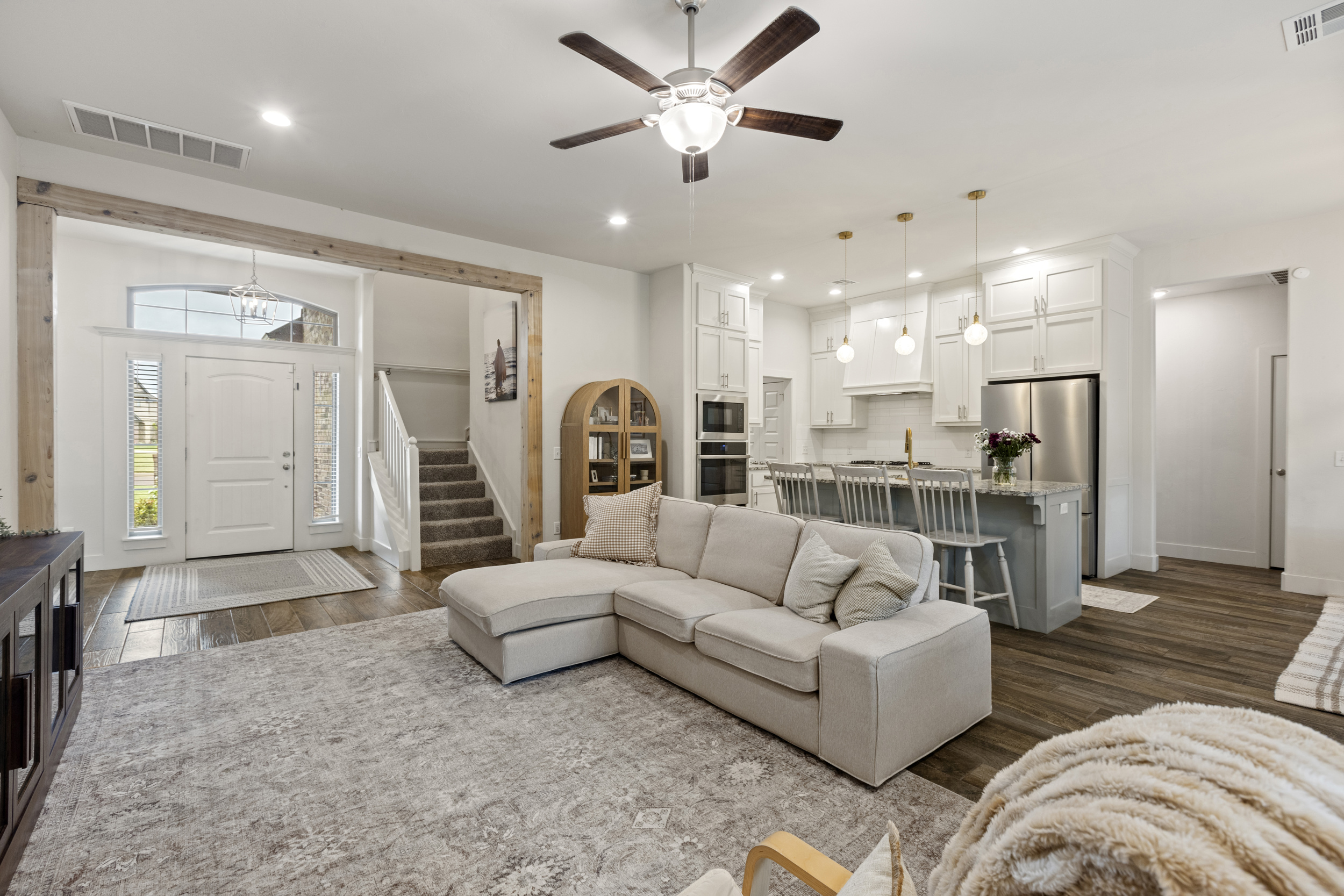 Staged open-plan living room and kitchen